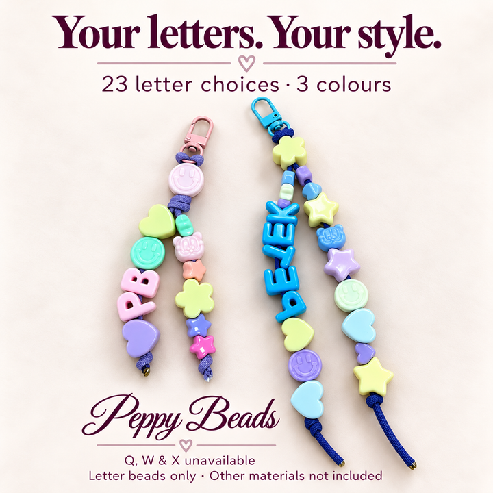 Blue acrylic letter beads for keyrings arranged in personalized designs, showcasing various colors and playful shapes.