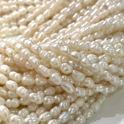 Perles d'eau douce en vrac baroques ovales blanc ivoire 4x5mm